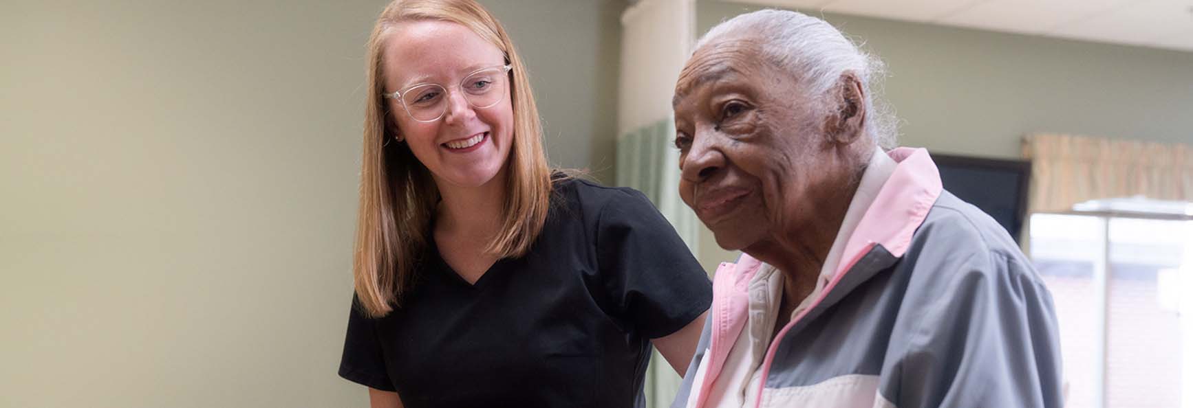 Older male patient interacting with clinical staff