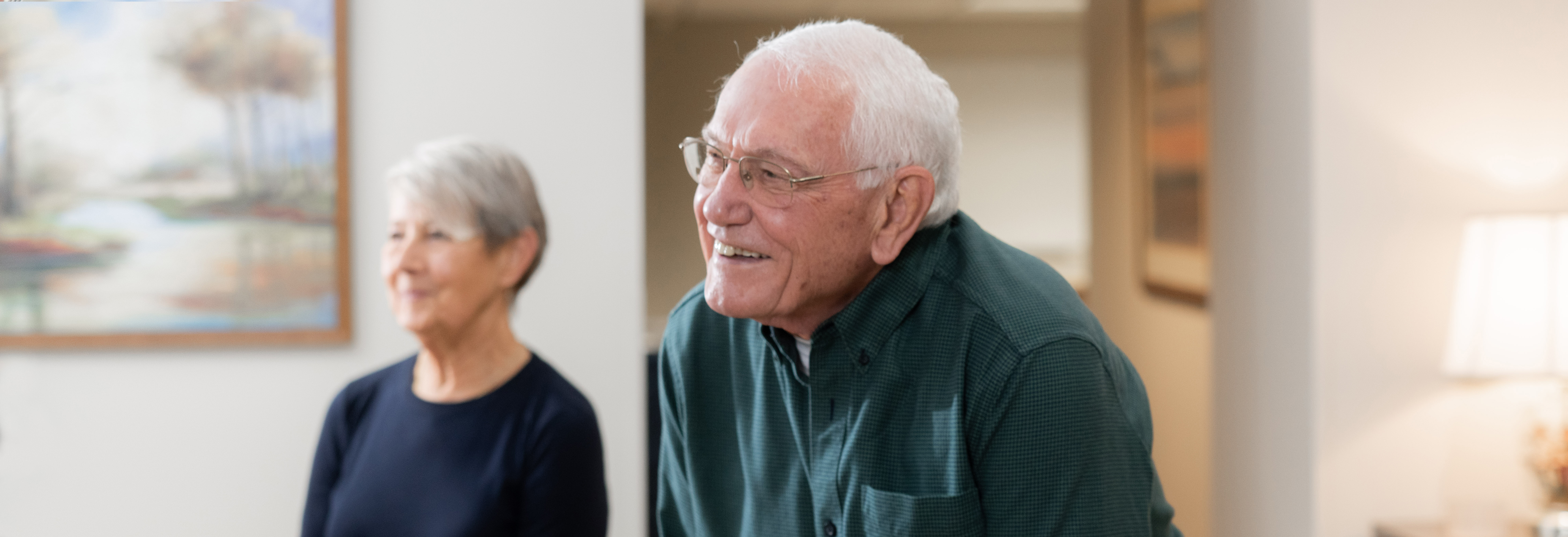 Older male patient interacting with clinical staff