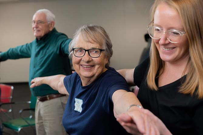 smiling patients during a physical therapy session